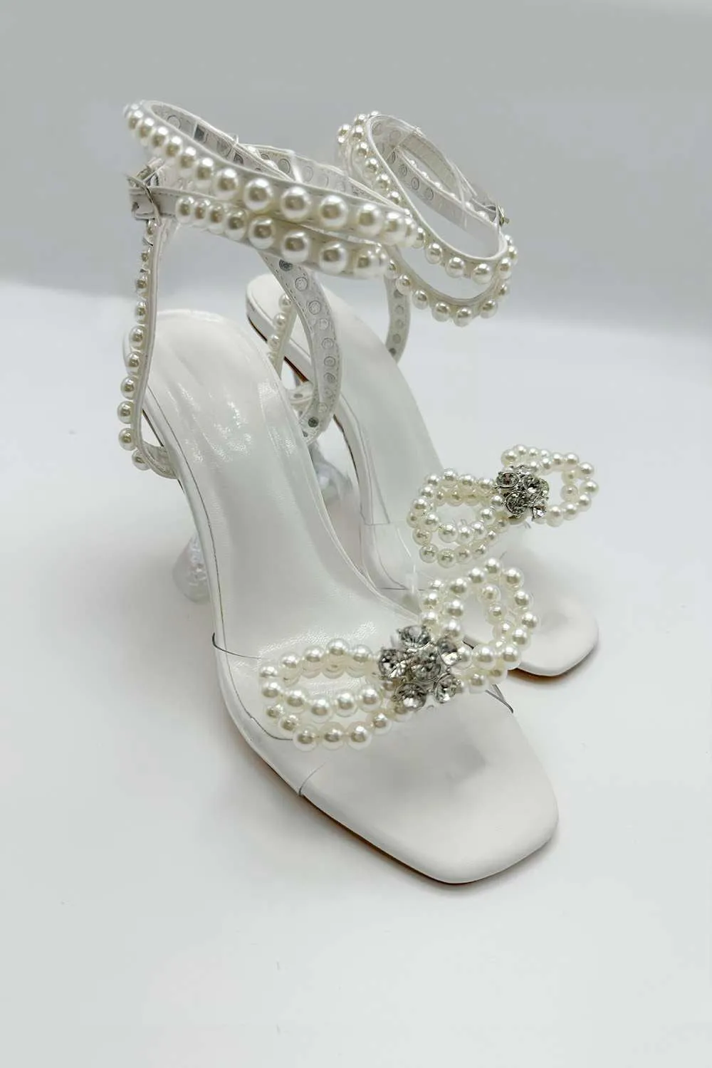 Pearlie Perspex Faux Pearl Bow Detail Heeled Sandals in White